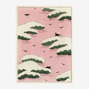 Oiseaux en vol parmi les nuages rose et vert