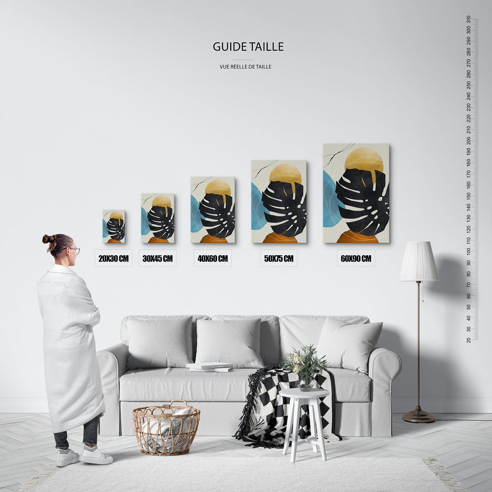Guide des tailles : le tirage présenté dans ses 5 formats de vente, à l'échelle réelle sur un mur de salon, avec une règle en centimètres.