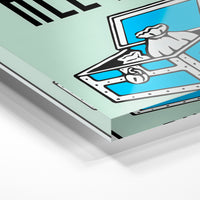Gros plan de la matière : le tirage sous verre acrylique, tranche transparente visible.