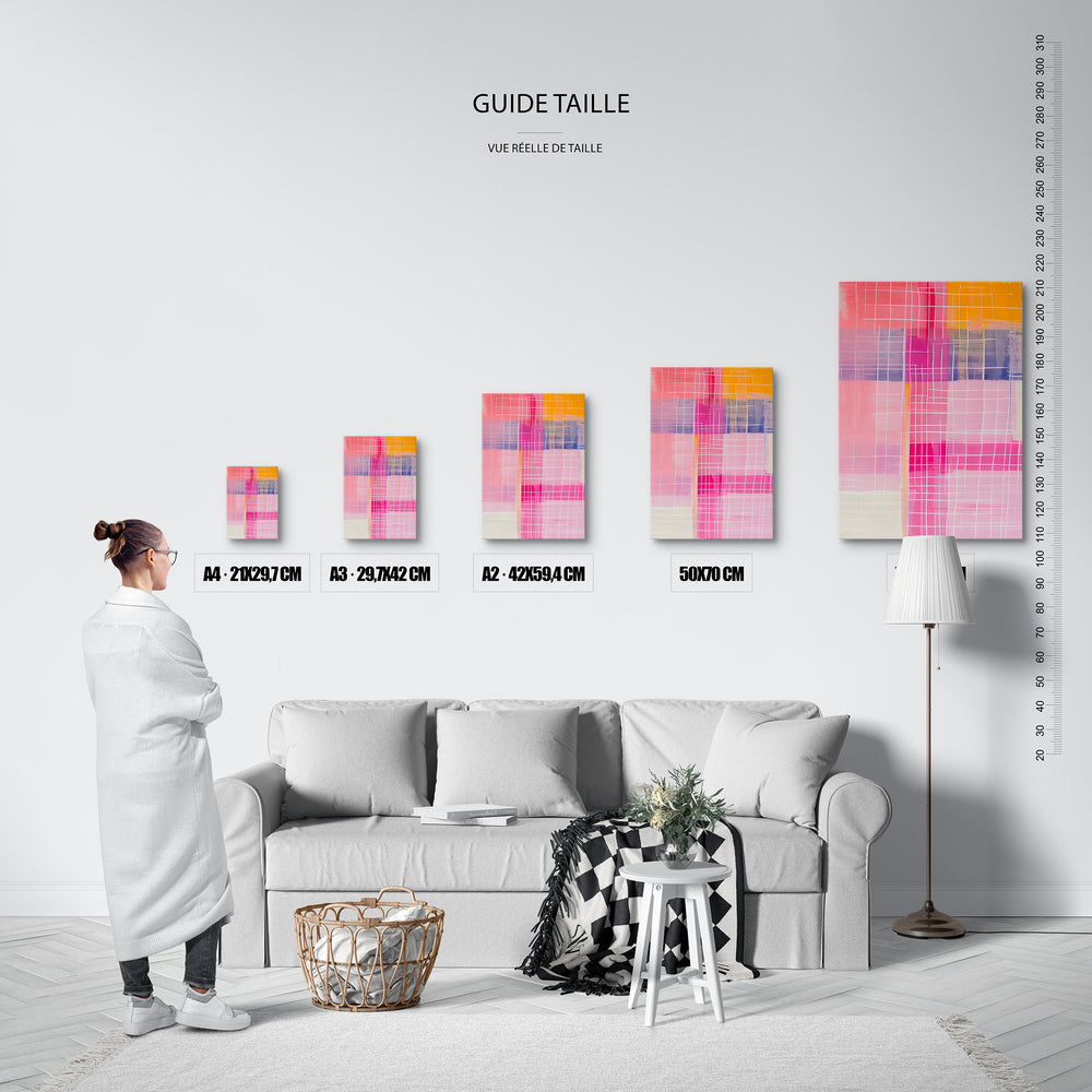 Guide des tailles : le tirage présenté dans ses 5 formats de vente, à l'échelle réelle sur un mur de salon, avec une règle en centimètres.