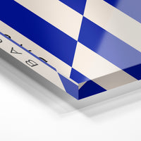 Gros plan de la matière : le tirage sous verre acrylique, tranche transparente visible.