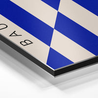 Gros plan de la matière : le tirage contrecollé sur aluminium Dibond mat, tranche visible.