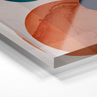 Gros plan de la matière : le tirage sous verre acrylique, tranche transparente visible.