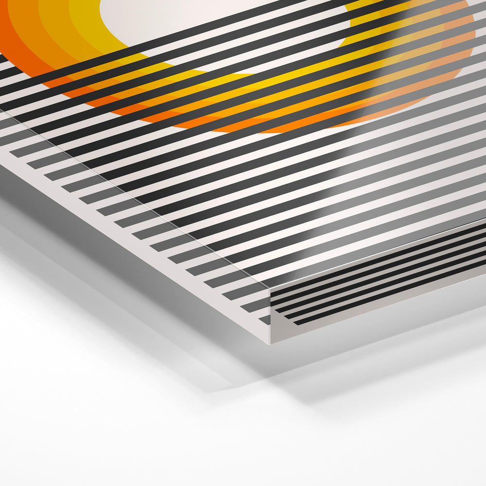 Gros plan de la matière : le tirage sous verre acrylique, tranche transparente visible.