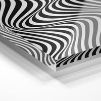 Gros plan de la matière : le tirage sous verre acrylique, tranche transparente visible.
