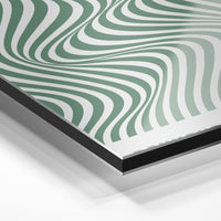 Gros plan du relief : la surépaisseur d'encre en lumière rasante sur aluminium Dibond.