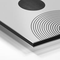 Gros plan de la matière : le tirage contrecollé sur aluminium Dibond mat, tranche visible.