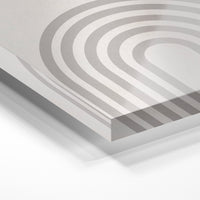 Gros plan de la matière : le tirage sous verre acrylique, tranche transparente visible.