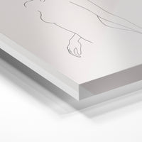 Gros plan de la matière : le tirage sous verre acrylique, tranche transparente visible.