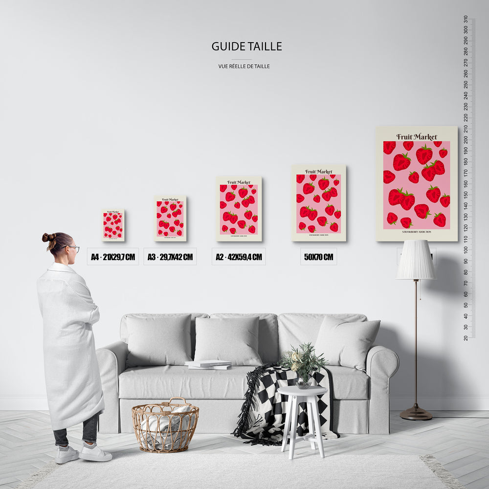 Guide des tailles : le tirage présenté dans ses 5 formats de vente, à l'échelle réelle sur un mur de salon, avec une règle en centimètres.