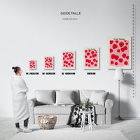 Guide des tailles : le tirage présenté dans ses 5 formats de vente, à l'échelle réelle sur un mur de salon, avec une règle en centimètres.