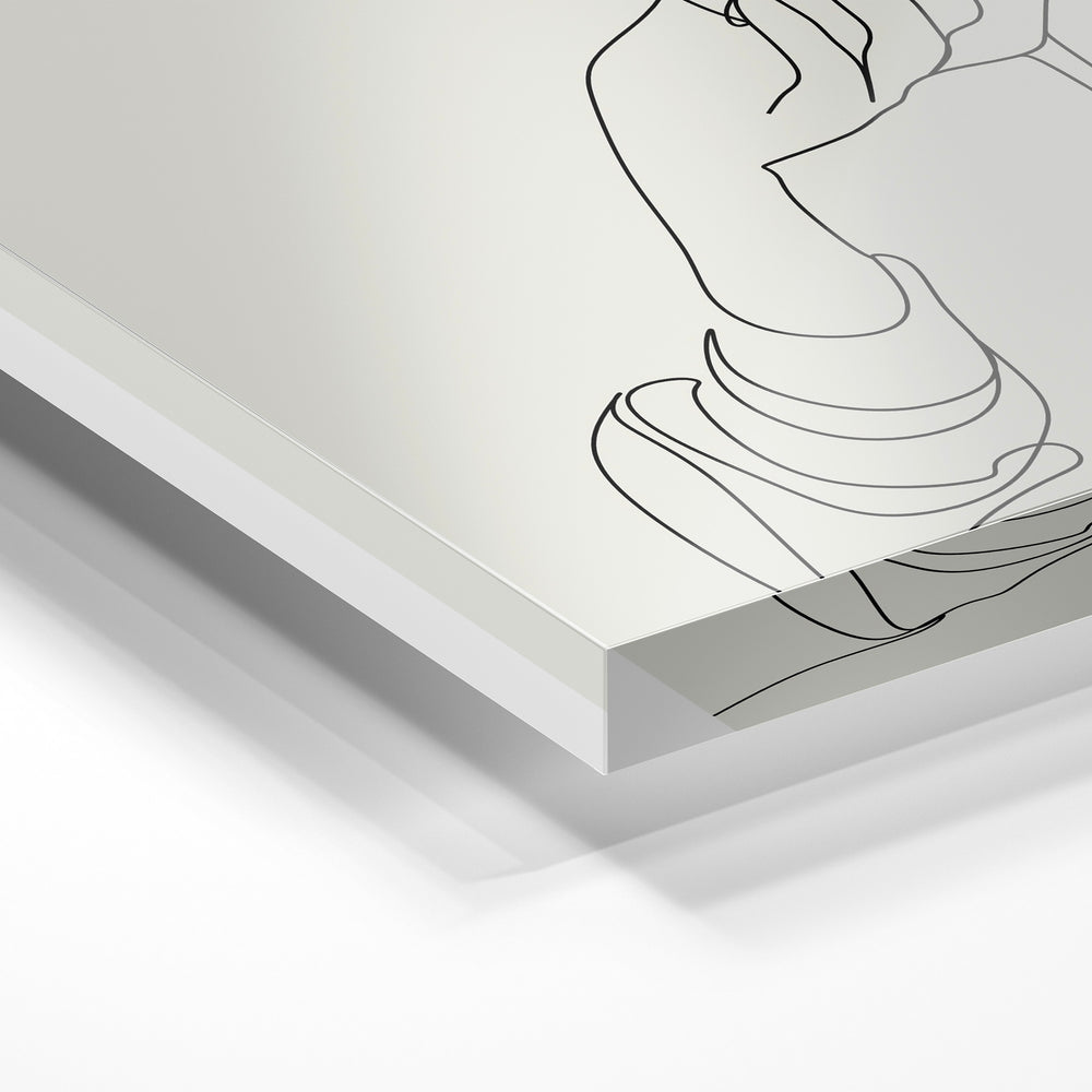 Gros plan de la matière : le tirage sous verre acrylique, tranche transparente visible.