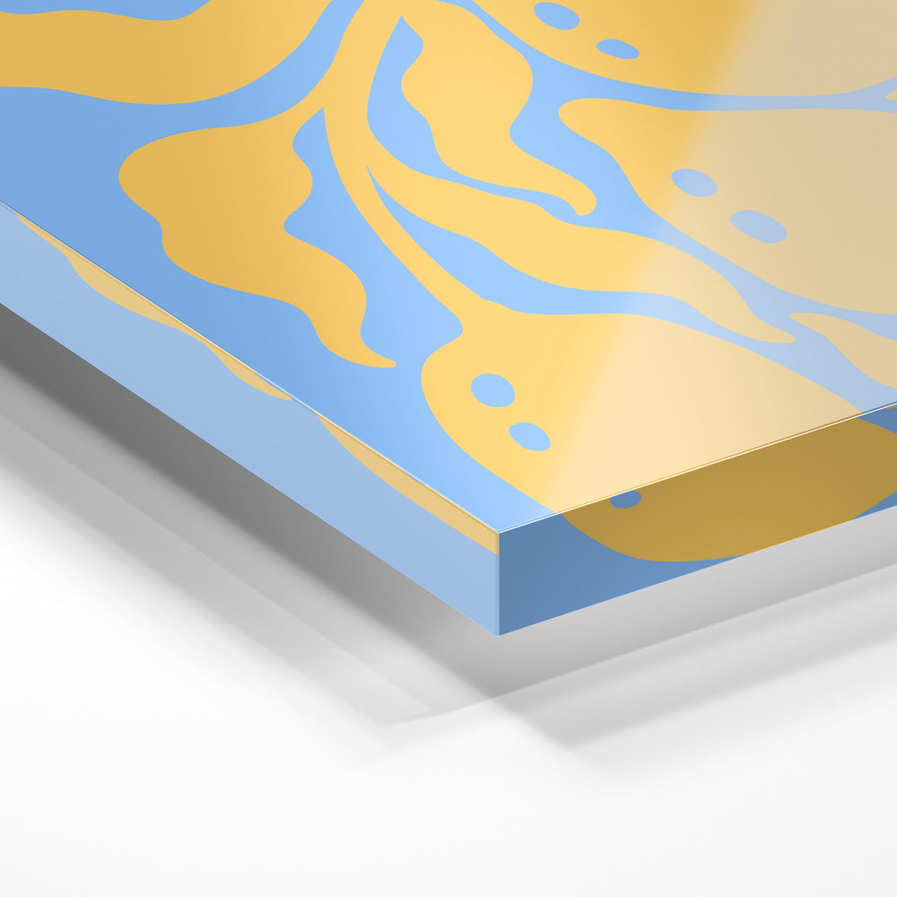 Gros plan de la matière : le tirage sous verre acrylique, tranche transparente visible.