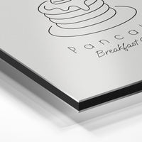 Gros plan de la matière : le tirage contrecollé sur aluminium Dibond mat, tranche visible.