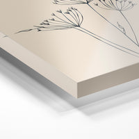 Gros plan de la matière : le tirage sous verre acrylique, tranche transparente visible.