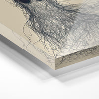 Gros plan de la matière : le tirage sous verre acrylique, tranche transparente visible.