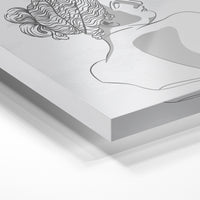 Gros plan de la matière : le tirage sous verre acrylique, tranche transparente visible.