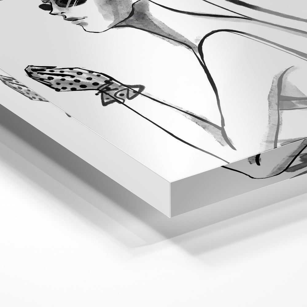 Gros plan de la matière : le tirage sous verre acrylique, tranche transparente visible.