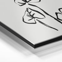 Gros plan de la matière : le tirage contrecollé sur aluminium Dibond mat, tranche visible.