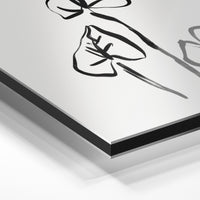 Gros plan du relief : la surépaisseur d'encre en lumière rasante sur aluminium Dibond.