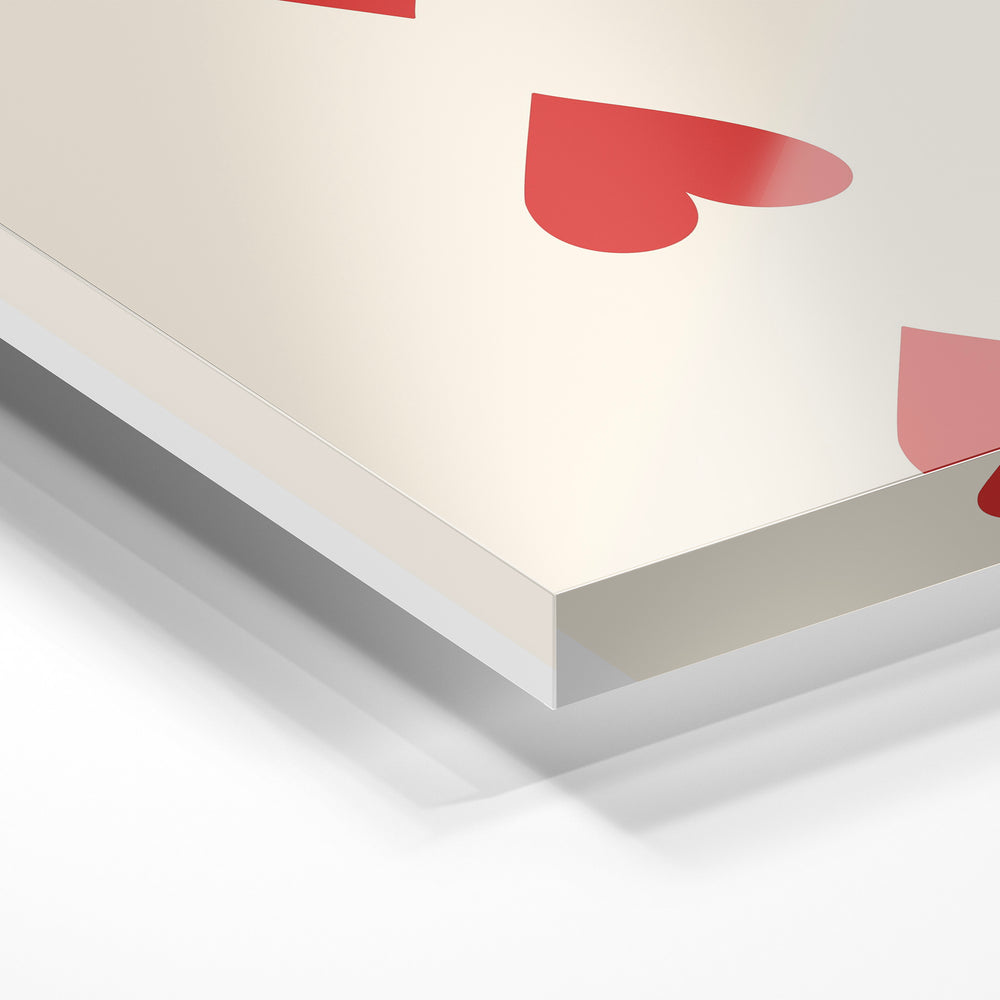 Gros plan de la matière : le tirage sous verre acrylique, tranche transparente visible.