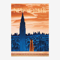 Couverture de magazine présentant un bâtiment iconique en silhouette noire se dressant devant un ciel orange flamboyant.