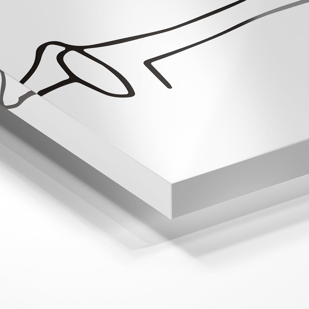 Gros plan de la matière : le tirage sous verre acrylique, tranche transparente visible.