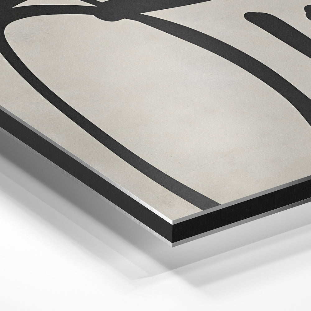 Gros plan de la matière : le tirage contrecollé sur aluminium Dibond mat, tranche visible.