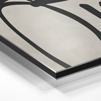 Gros plan de la matière : le tirage contrecollé sur aluminium Dibond mat, tranche visible.