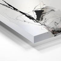 Gros plan de la matière : le tirage sous verre acrylique, tranche transparente visible.