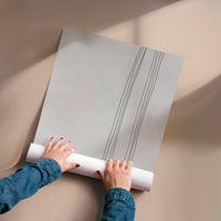 L'impression présentée en poster, sans encadrement, sur un mur neutre.