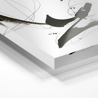 Gros plan de la matière : le tirage sous verre acrylique, tranche transparente visible.