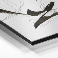 Gros plan de la matière : le tirage contrecollé sur aluminium Dibond mat, tranche visible.