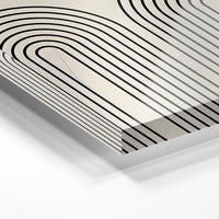 Gros plan de la matière : le tirage sous verre acrylique, tranche transparente visible.