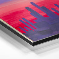 Gros plan de la matière : le tirage contrecollé sur aluminium Dibond mat, tranche visible.