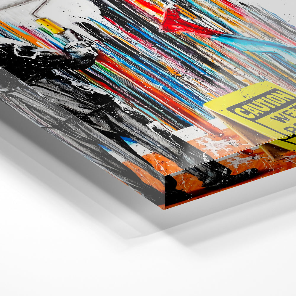 Gros plan de la matière : le tirage sous verre acrylique, tranche transparente visible.