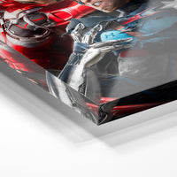 Gros plan de la matière : le tirage sous verre acrylique, tranche transparente visible.