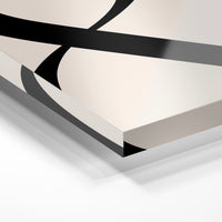 Gros plan de la matière : le tirage sous verre acrylique, tranche transparente visible.
