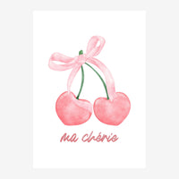 Deux cerises en forme de cœur rose reliées par un ruban rose noué au-dessus, avec le texte « ma chérie » écrit en dessous.