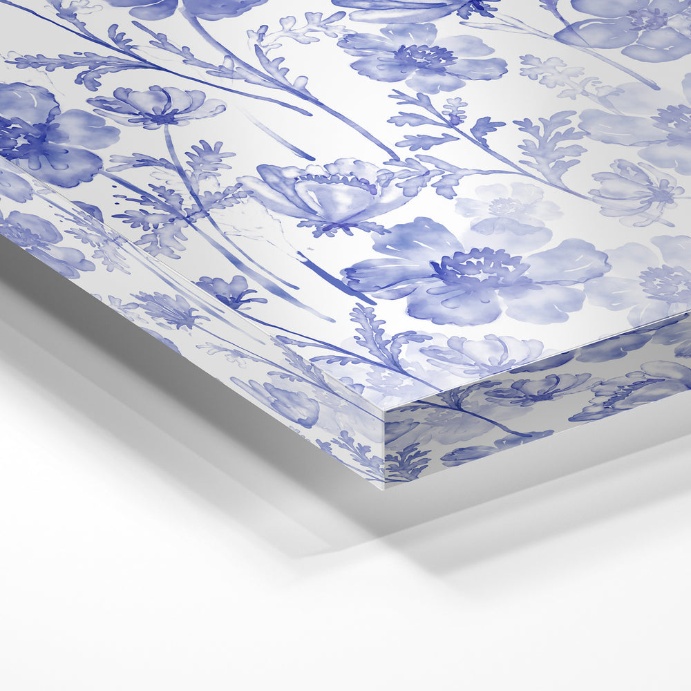 Gros plan de la matière : le tirage sous verre acrylique, tranche transparente visible.