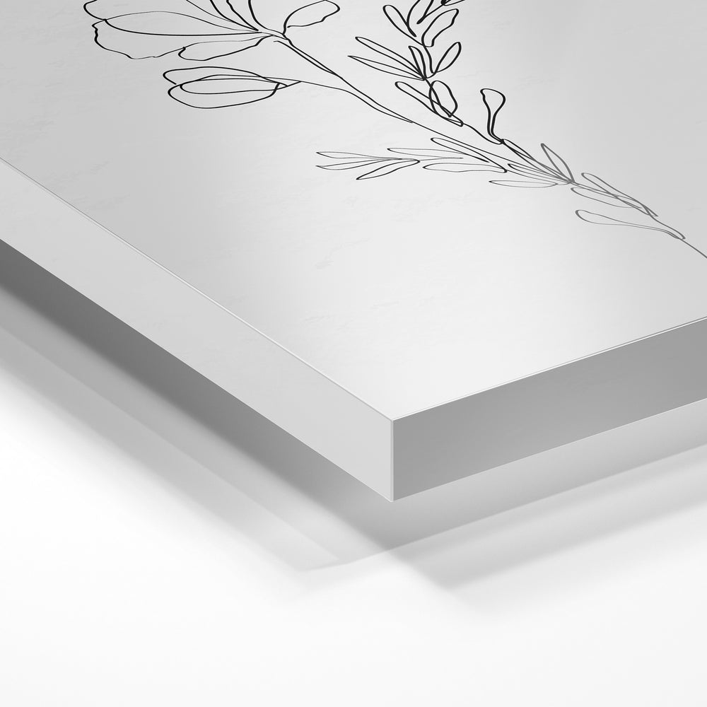 Gros plan de la matière : le tirage sous verre acrylique, tranche transparente visible.