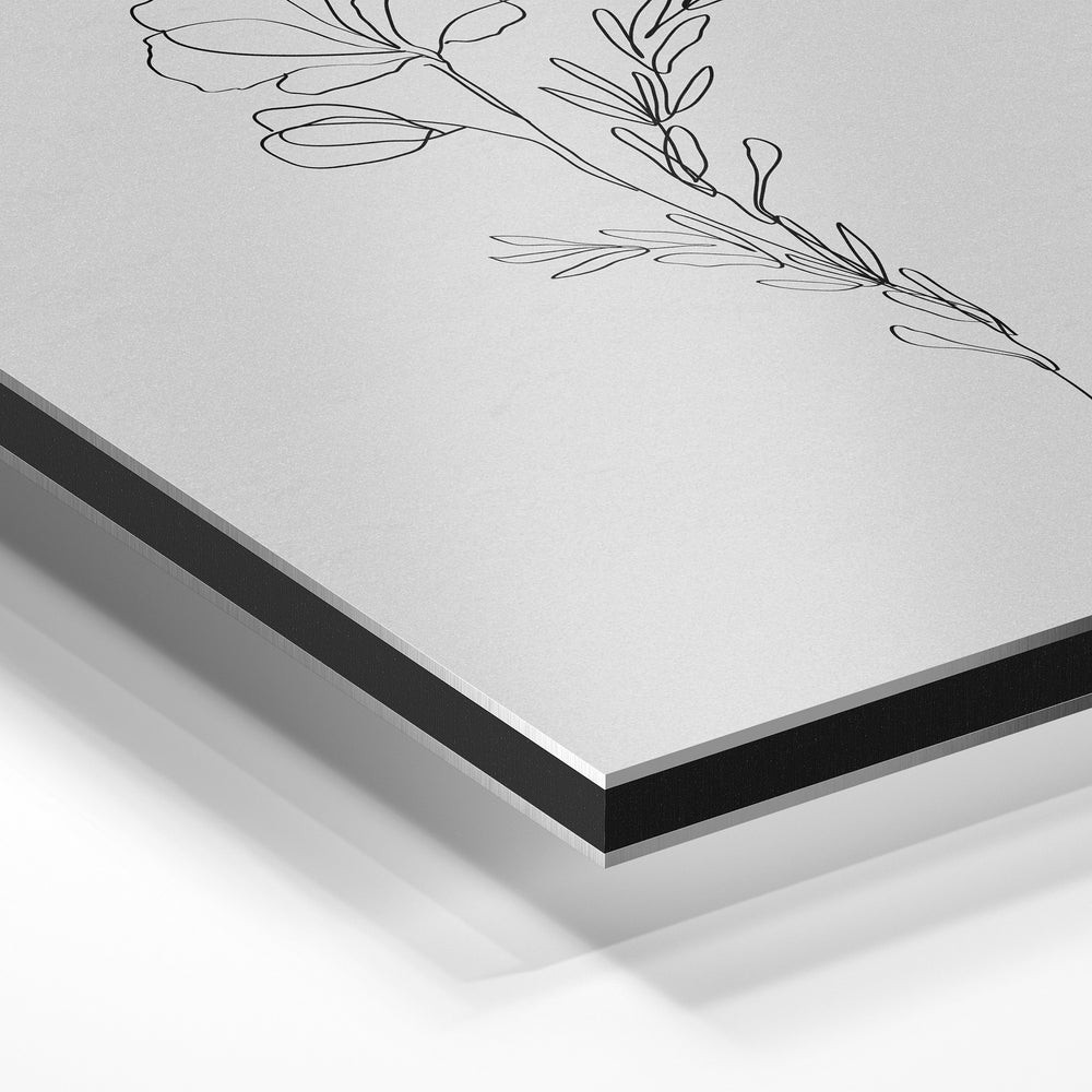 Gros plan de la matière : le tirage contrecollé sur aluminium Dibond mat, tranche visible.