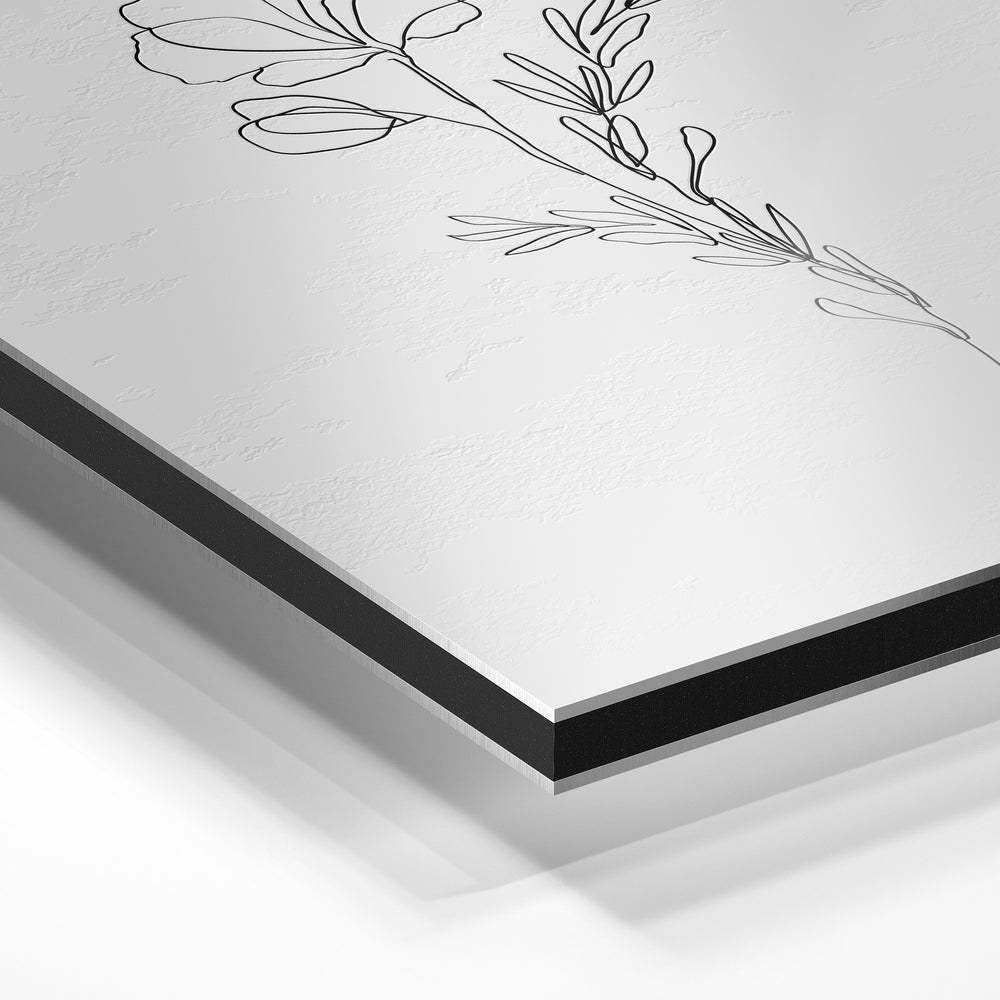 Gros plan du relief : la surépaisseur d'encre en lumière rasante sur aluminium Dibond.