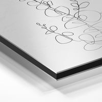 Gros plan du relief : la surépaisseur d'encre en lumière rasante sur aluminium Dibond.