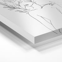 Gros plan de la matière : le tirage sous verre acrylique, tranche transparente visible.