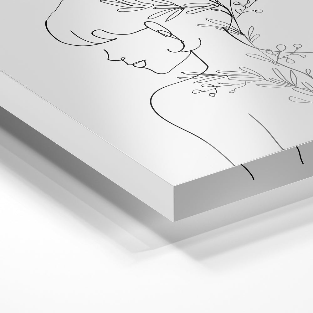 Gros plan de la matière : le tirage sous verre acrylique, tranche transparente visible.