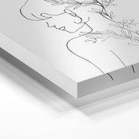 Gros plan de la matière : le tirage sous verre acrylique, tranche transparente visible.