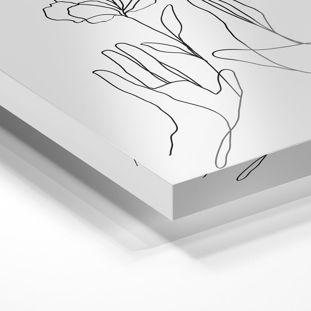 Gros plan de la matière : le tirage sous verre acrylique, tranche transparente visible.