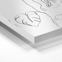 Gros plan de la matière : le tirage sous verre acrylique, tranche transparente visible.