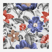 Composition de fleurs botaniques avec pétales bleu indigo et rouge corail, feuillage gris détaillé, sur fond blanc.
